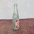 This is a wonderfully distressed 1940s French Pepsi Cola Bottle. It will look great on your shelf or in your man cave and...