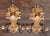 Vintage pair of Italian Rococo-style carved wood two-arm candle wall sconces. Each sconce features an ornate, heavily...
