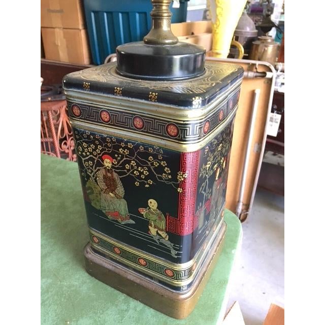 I do not know when this was converted to a lamp, but the tin is vintage. You can still see the hinges on it! Classic and...