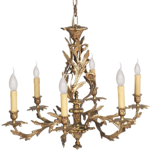 This is an antique 18th century very heavy electrified chandelier that previously held candles. It is made of gilded...