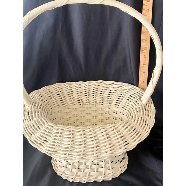 Vintage Cream Hand Woven Uniquely Shaped Wicker and Wood Basket Featuring a Tall Arched Wooden Handle and a Flared Rim by...