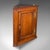 This is a small antique corner cabinet. An English, golden oak hanging cupboard, dating to the Mid Georgian period, circa...