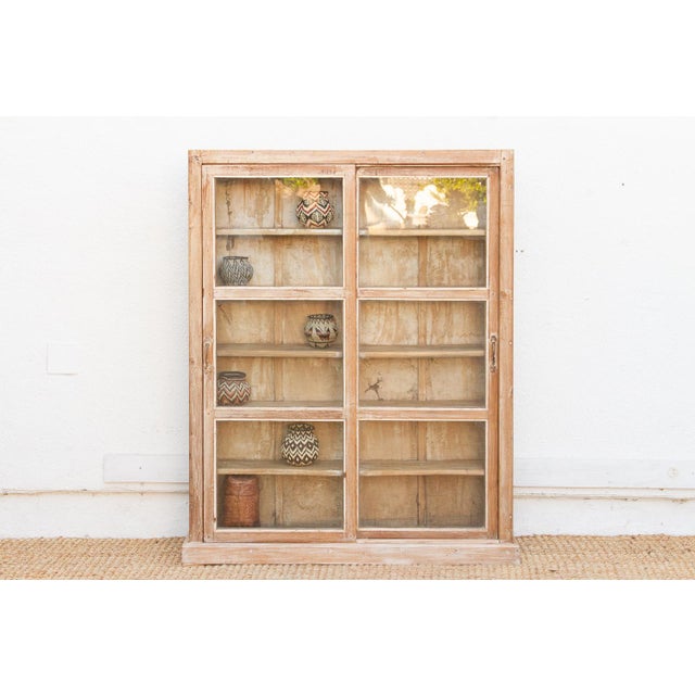 This 55-inch tall cabinet is an exceptionally rare "slim-fit" find, measuring only 10 inches in depth. Crafted from solid...