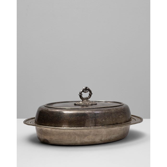 Originating from France in the early 20th century, this elegant silver-plated roasting pan embodies timeless craftsmanship...