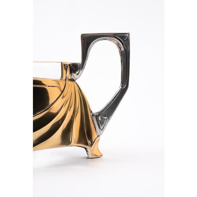 Jugendstil centerpiece mad of alpaca and brass with glass around 1908 Polished and stove enameled Original glass