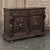 A richly carved 19th century oak hunt buffet executed in the Renaissance Revival style, celebrating the romanticized love...