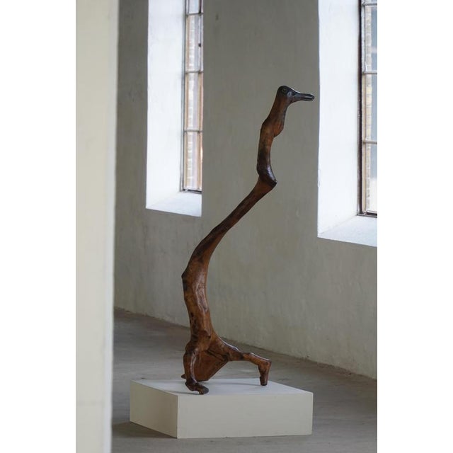 A beautiful mid-century abstract wooden sculpture, hand-carved into a bird organic form. Made by a French cabinetmaker in...