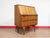 A beautiful secretaire with stunning sculpted handles, this Mid Century Modern Vintage Teak Bureau Secretaire Desk by S...