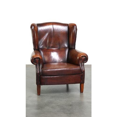 A luxurious sheep leather wing chair with a fixed seat cushion and a high level of seating comfort. This sturdy, but also...