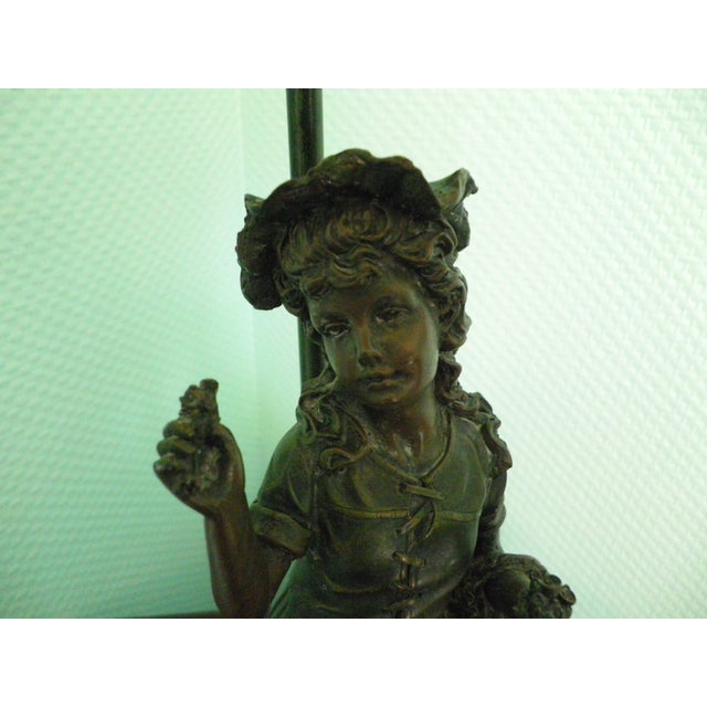 ROSA table lamp from 1999 with a pâte de verre lampshade, a young girl with a basket in spelter, and an approximately 2m...