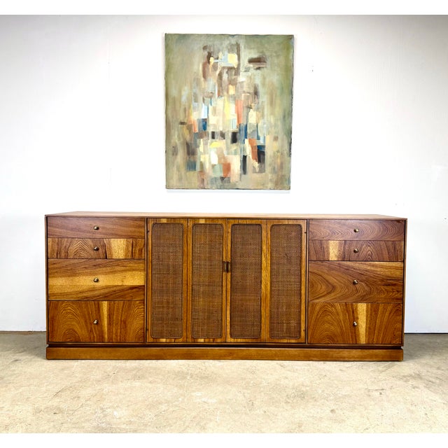 A gorgeous mid century modern credenza in pecan or fruitwood by Kaufman of Collingwood, Canada. Newly restored in zero VOC...