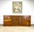 A gorgeous mid century modern credenza in pecan or fruitwood by Kaufman of Collingwood, Canada. Newly restored in zero VOC...