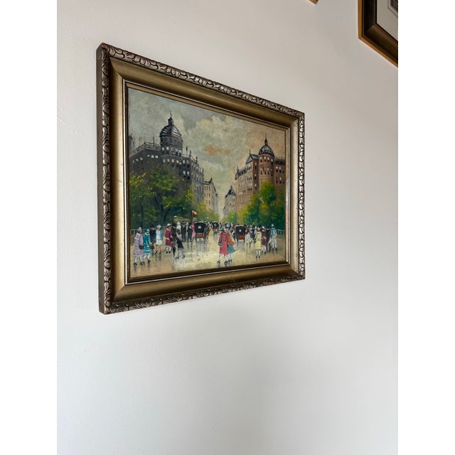 This charming 1950s vintage oil painting on canvas captures the essence of a bustling Parisian street scene. The...