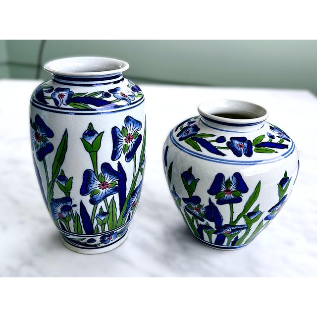 Vintage Mid-Century Chinese porcelain vases. Hand-painted with vibrant blue irises and green leaves against white...