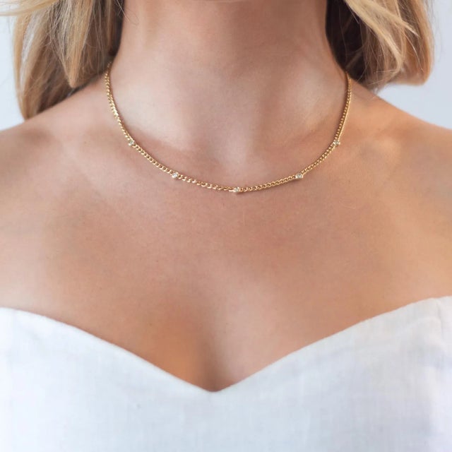 This is part of Chairish’s Fine Jewelry assortment. The perfect layering necklace. A thinner cuban chain with five...