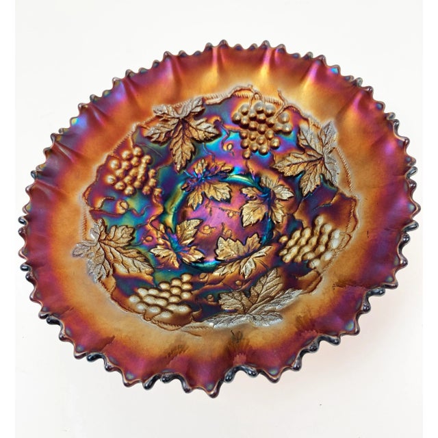 This spectacular 8.5" amethyst carnival glass bowl by Northwood has captured the rainbow on an autumn day. The stunning...
