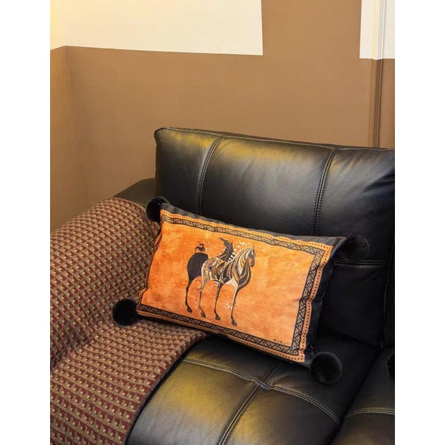 This lumbar pillow, with a warm and bright orange hue as its base, presents a decorative scroll filled with Bohemian...