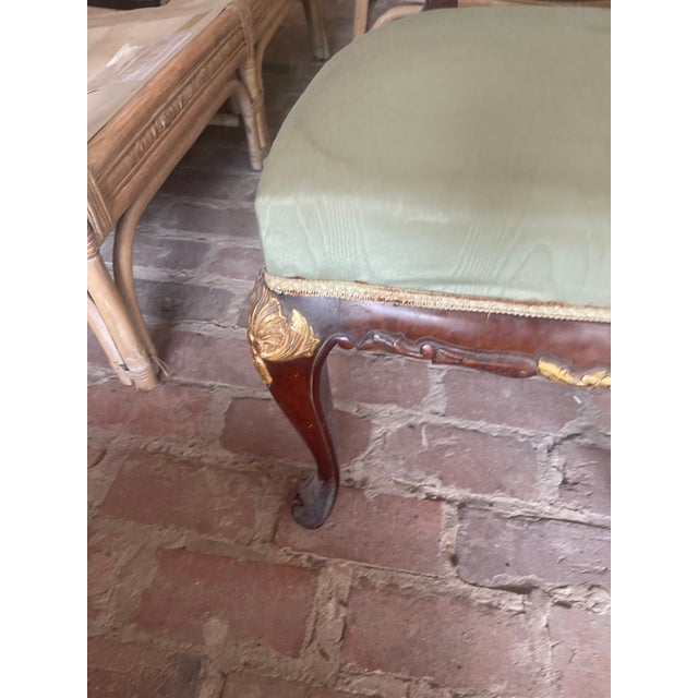 Set of 3 parlor chairs featuring carved wood frames and sage green upholstered seats and backrests. The set includes a...
