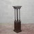 This entryway plant stand, dating back to the early 20th century, reflects the understated taste and solidity typical of...