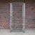 Sleek vintage Mid-Century Modern chrome and glass étagère or display shelf, circa 1970s. The tall architectural frame is...