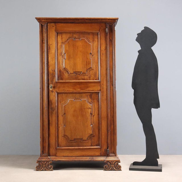 Small Baroque walnut wardrobe made from antique furniture. Paneled front door, divided into two parts with high-relief...