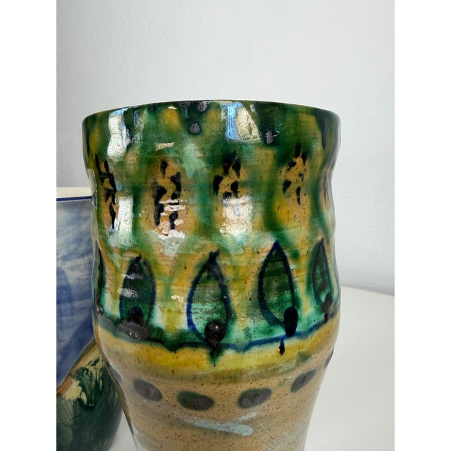 A decorative pair of Danish ceramic vases dating from the 1960s/70s, representing the warm, handcrafted aesthetic...