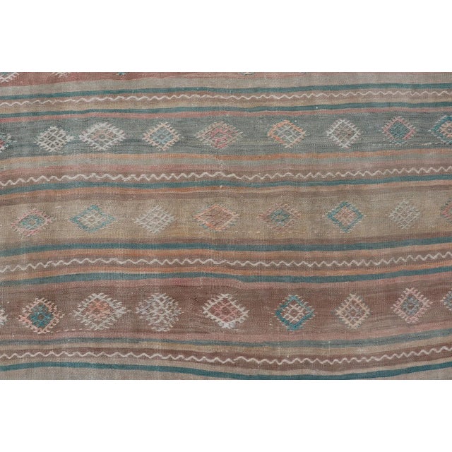 Mid 20th Century Mid 20th Century Vintage Turkish Gallery Kilim With Stripes and Tribal Motifs in Muted Tones For Sale - Image 9 of 13