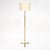 Floor lamp from the Art Deco period in France. This piece is made with a ridged brass stem while the tripod foot is of...