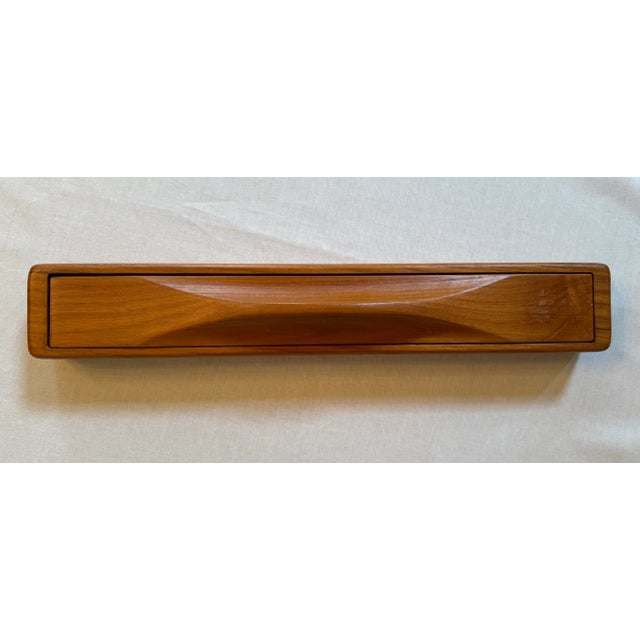 A genuine solid teakwood box with a caramel grain color exudes Danish clean lines in a simple organic modern style. The...