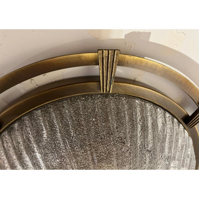 A wonderful 1960s Nautical Style Flush ligh done in a bronze/aged brass fixture with a hand blown Murano glass shade....