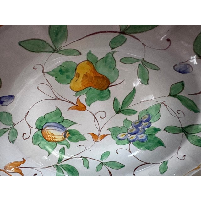 This vibrant hand painted shallow bowl comes from the town of Fiesole in Italy where Richard Ginori and other fine...