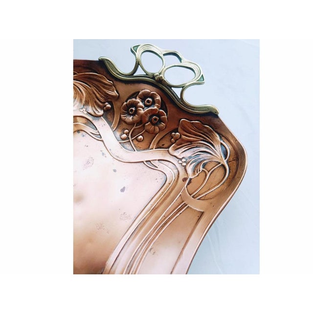 Authentic vintage decorative tray, made of brass with a polished finish and openwork handles with a sinuous design. The...