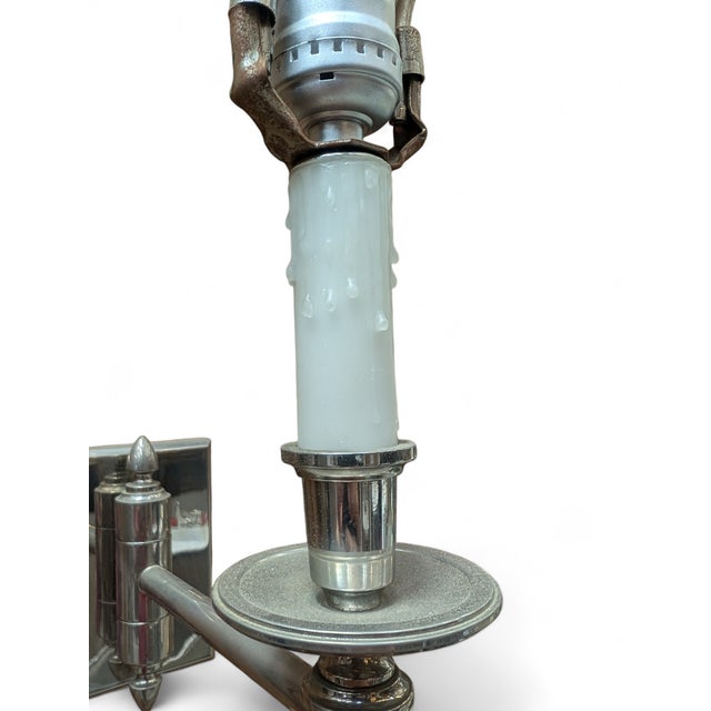 Phoenix Day Huntington swing arm wall sconces. Fine cast brass construction with polished nickel finish. Wax candle...