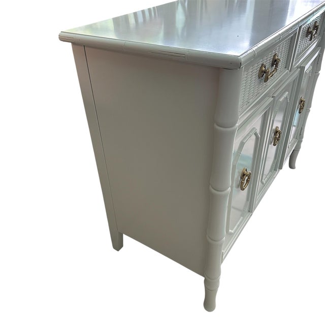 I have included a photo of the makers mark or label attached to inside the drawer. Broyhill faux bamboo server / buffet....