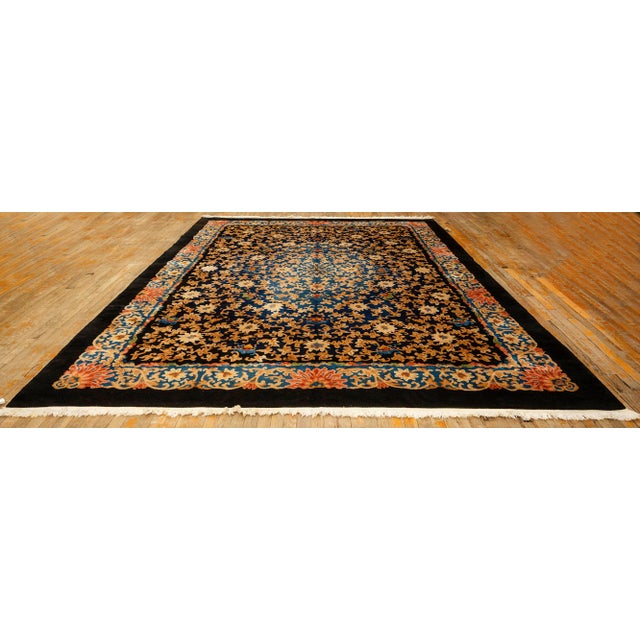 An impressive room-sized Antique Chinese carpet, expertly hand-knotted from high-quality wool. Measuring 9' 3" x 11' 8",...