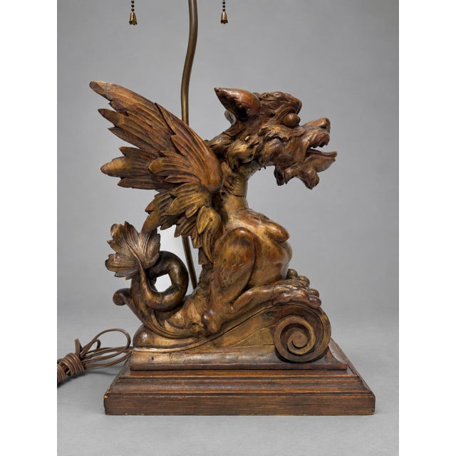 Continental Renaissance Revival Carved Dragon Griffin Table Lamp, c. 1890-1930 A dramatic carved figural table lamp, the...