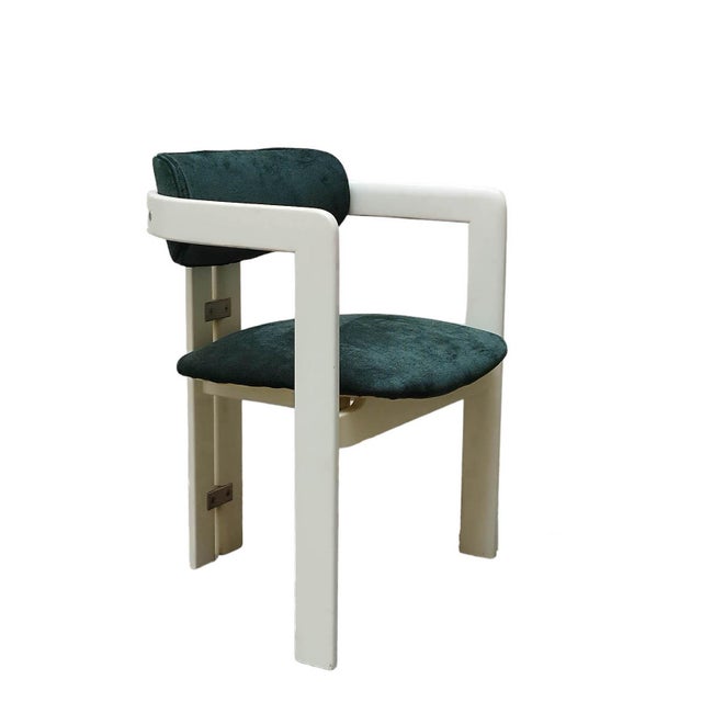 the Pampelona chair designed by Augusto Savini in the 1960s is a model prized for its massive wooden frame that forms two...