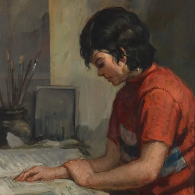 A Framed Oil on Canvas Titled "Young Seated Girl Artist" depicts a young girl seated in a moment of intense focus. She's...