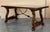 Dining table made of walnut with carved lyre legs and heavy top. The lyre legs are very thick. Beautiful iron stretcher,...