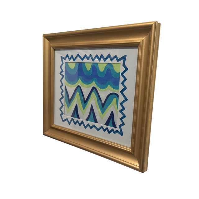 Lola is a one of a kind framed textile artwork featuring Schumacher’s Zig Zag Weave, a bold designer fabric wall art piece...