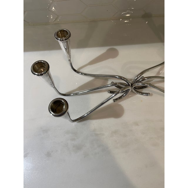 Beautiful pair of sterling silver weighted candlesticks. Each candlestick can accommodate 3 candles and can be placed...