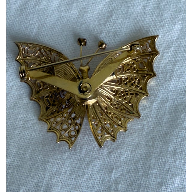 Vintage 1960s Art Nouveau Revival Gold Tone Filigree Butterfly Brooch With Blue Rhinestone Accents For Sale In New York - Image 6 of 7