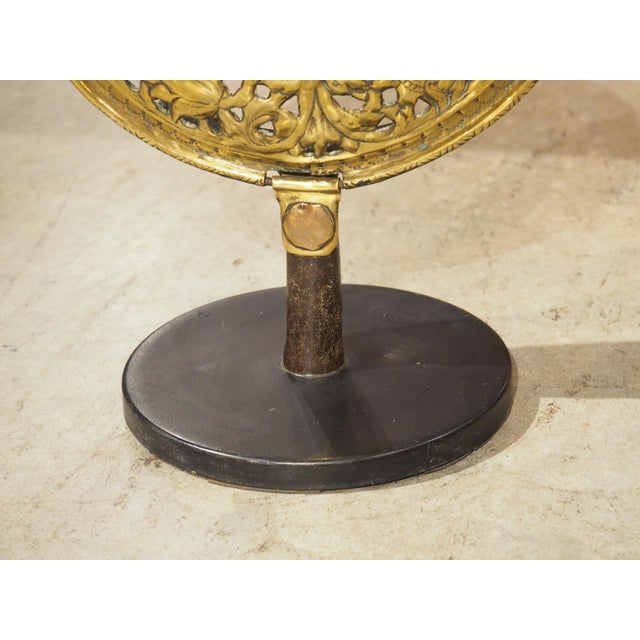 This highly pierced brass decorative element from France was originally the cover of a bassinoire from the 1600s. A...
