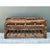 Crafted in sturdy bent rattan with leather-wrapped corner bindings, this vintage coffee table captures the exotic elegance...