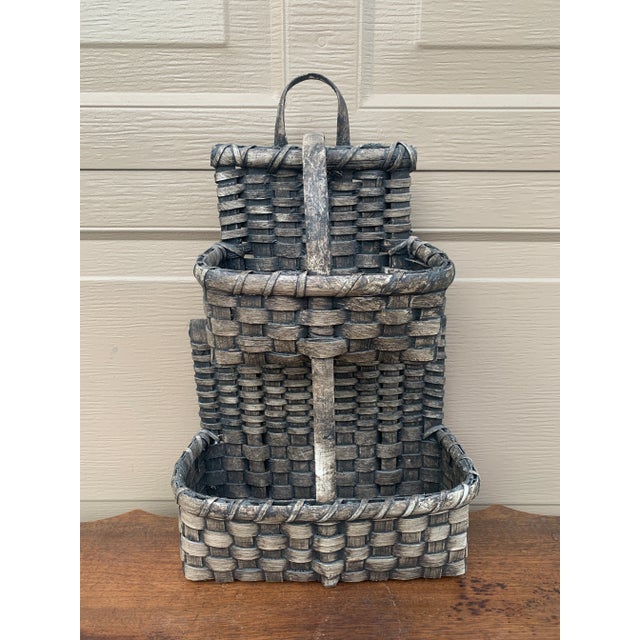 A beautifully woven early 20th century American splint oak double hanging basket painted in soft gray tones with a tightly...