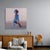 The artwork depicts a solitary figure kneeling, enveloped in ethereal shades of blue that blend seamlessly with the soft,...