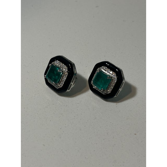 From the personal collection of Kathy Hilton. Offering a black, faux emerald and rhinestone stud earrings. A useful and...