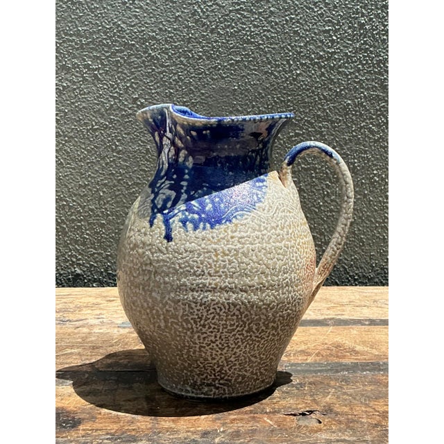 Add an authentic touch of rustic sophistication to your home with this exceptional vintage hand-crafted studio pottery...