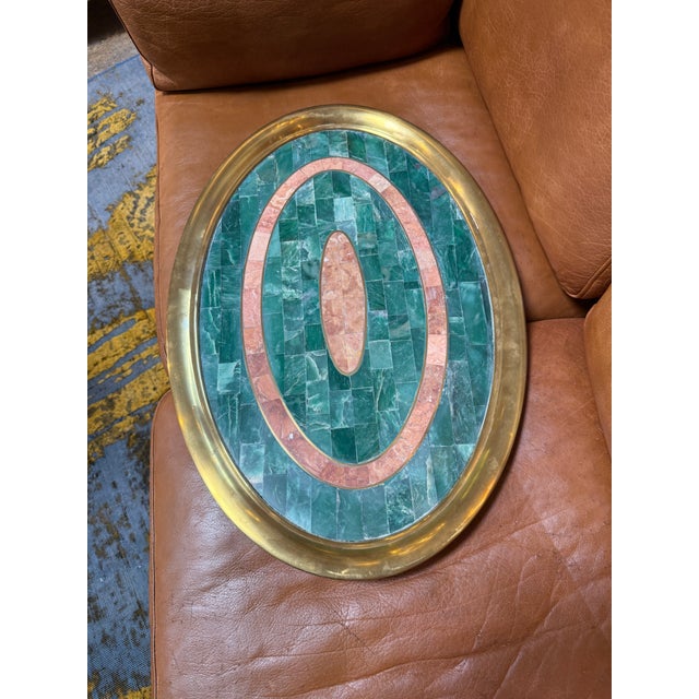 Elegant Italian mid-century oval tray crafted in the 1970s, featuring a polished brass gallery surrounding a decorative...