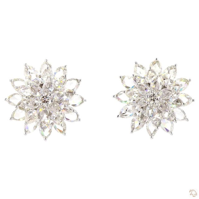 This pair of drop earrings from our contemporary estate collection centers on a 5.78-carat diamond in a rose cut, prized...